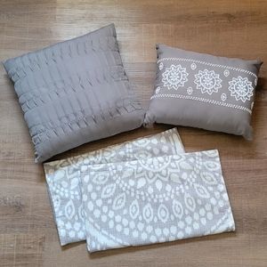 Two decorative pillows and two king size pillow shams.